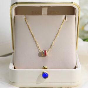 Boucheron Gold Tone Cylinder Pendant Necklace with Red and Black Enamel